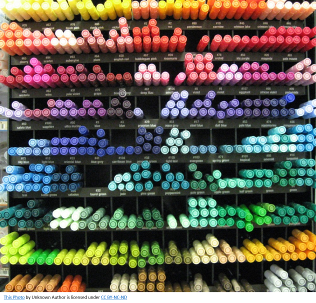 markers stored on a wall by color